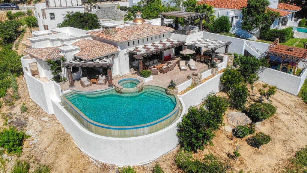 Los Cabos Luxury Park Hyatt Villa Mariposa is a stunning three-bedroom oceanfront retreat designed for those seeking privacy, tranquility, and timeless Baja elegance. Showcasing classic Hacienda-style architecture, the villa features rich wood furnishings, warm finishes, and tasteful pops of color that create an inviting and sophisticated atmosphere throughout.Wake up to the soothing sound of the waves and spend your days enjoying the private pool and hot tub overlooking the Sea of Cortez. The expansive terrace provides the perfect setting for al fresco dining, sunset cocktails, or simply relaxing while watching whales pass by during the season.The gourmet kitchen is equipped with high-end appliances and complemented by a charming breakfast nook. See more... The open-concept living and dining areas seamlessly connect to the spacious terrace, maximizing indoor-outdoor living and capturing breathtaking ocean – 115 La Noria, San Jose del Cabo, BS