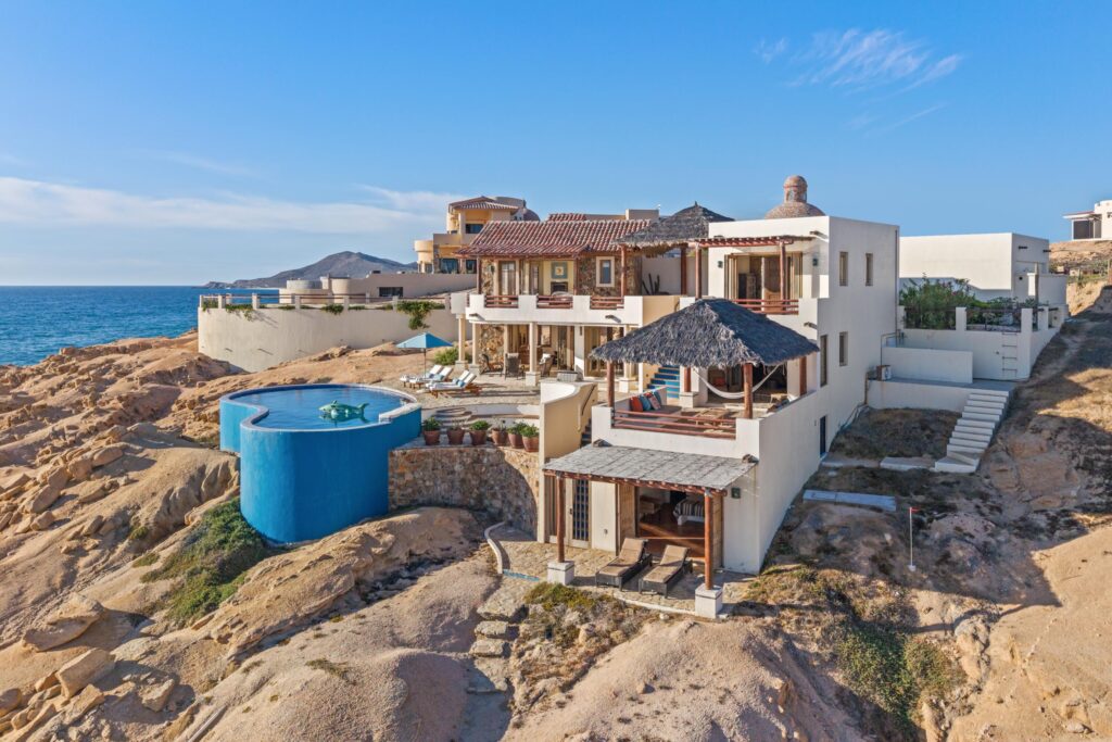 Los Cabos Luxury Rancholasmargaritas Casa Playa Escondida - Oceanfront Luxury in Baja California SurPerched dramatically on the rocks above the Pacific Ocean, Casa Playa Escondida is a rare oceanfront retreat set along a secluded, pristine stretch of beach. Located within the exclusive off-grid gated community of Rancho Las Margaritas, this one-of-a-kind property offers privacy, tranquility, and breathtaking natural beauty--just a 20-minute drive to the dining and shopping of Cabo San Lucas, 40 minutes from Los Cabos International Airport, and approximately 30 minutes south of Cerritos and Todos Santos.The residence features three spacious ensuite bedrooms, each privately situated yet connected by terraces, pathways, and shared gathering spaces. A dedicated media room offers flexibility as a fourth bedroom or additional guest suite.Expansive terraces and multiple lounging areas provide a variety of vantage points to take in the surrounding landscape, from the rugged coastline to the endless Pacific horizon.The gourmet kitchen is equipped with high-end appliances and designed for both functionality and style. A warm and inviting living and dining area, anchored by a striking fireplace, creates the perfect space for entertaining or relaxing with family and friends. The home is offered fully furnished with includes modern off-grid conveniences such as solar power.Outdoor living is equally exceptional, featuring a swimming pool, firepit, grilling area, and multiple seating spaces--ideal for enjoying the serene coastal setting – 75 Avenue de Marlin, Pacific, BS