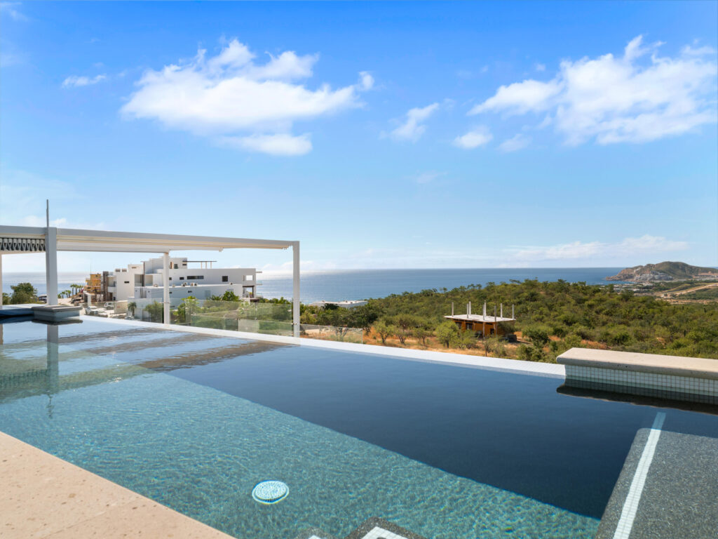 Los Cabos Luxury Section 4- Las Canadas Discover refined indoor-outdoor living at Cañada 9, set within Querencia, San Jose del Cabo's premier private golf community. Soaring beamed ceilings, walls of pocket glass, and luminous marble floors define an open great room that flows effortlessly to the terrace, infinity-edge pool, and stone-clad water feature -- all framed by panoramic Sea of Cortez and mountain – El Tule, San Jose Corridor, BS