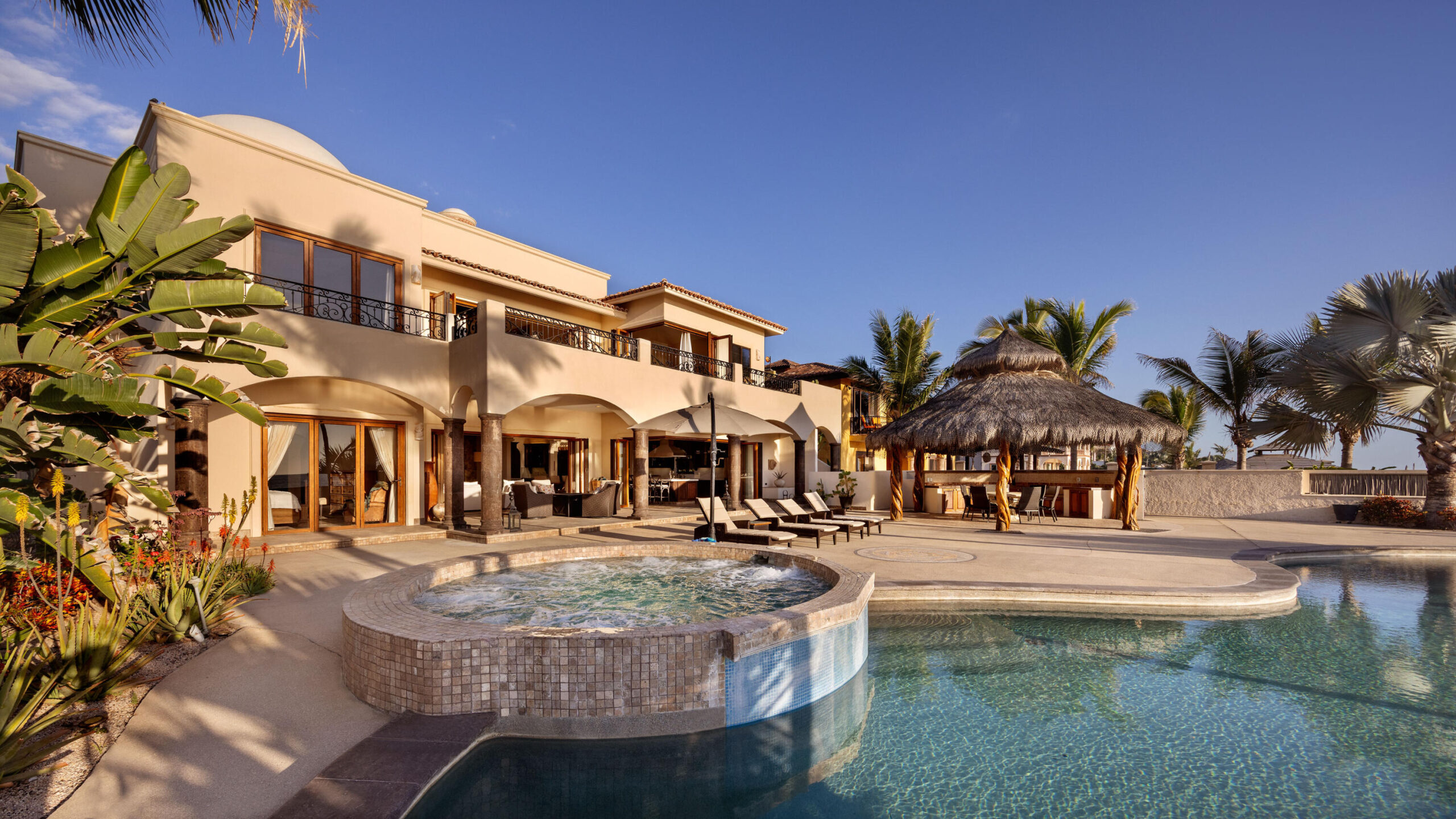 Los Cabos Luxury Park Hyatt Villa Mariposa is a stunning three-bedroom oceanfront retreat designed for those seeking privacy, tranquility, and timeless Baja elegance. Showcasing classic Hacienda-style architecture, the villa features rich wood furnishings, warm finishes, and tasteful pops of color that create an inviting and sophisticated atmosphere throughout.Wake up to the soothing sound of the waves and spend your days enjoying the private pool and hot tub overlooking the Sea of Cortez. The expansive terrace provides the perfect setting for al fresco dining, sunset cocktails, or simply relaxing while watching whales pass by during the season.The gourmet kitchen is equipped with high-end appliances and complemented by a charming breakfast nook. See more... The open-concept living and dining areas seamlessly connect to the spacious terrace, maximizing indoor-outdoor living and capturing breathtaking ocean for sale