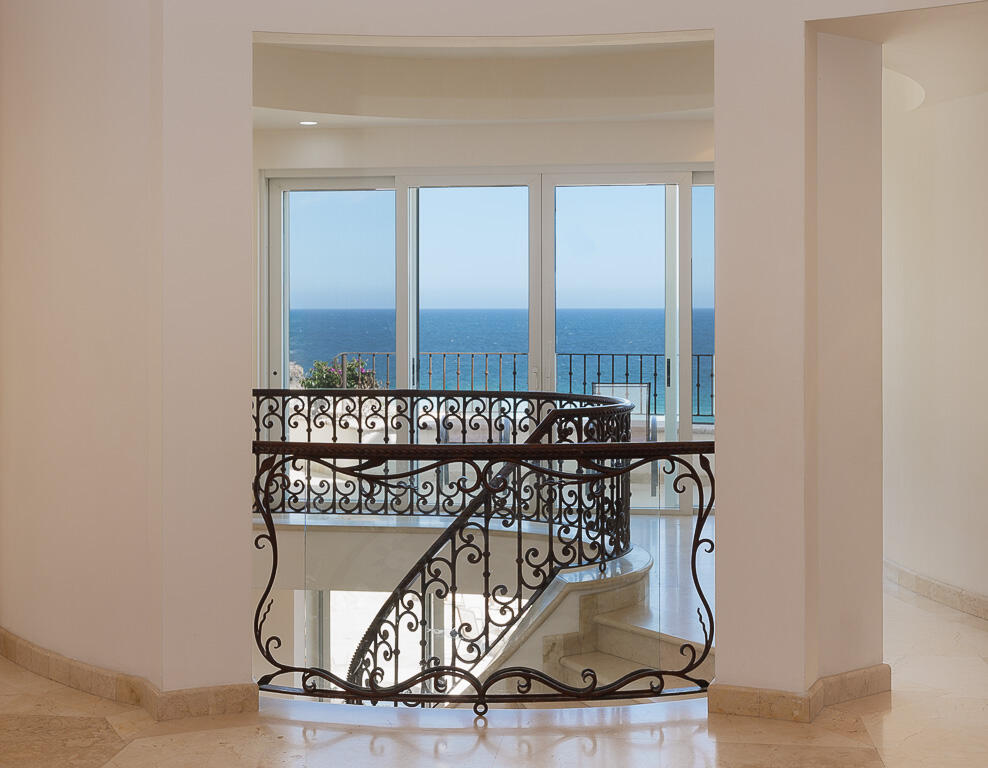 Los Cabos Luxury Pedregal Csl Villa Marcella sits on an exquisite piece of ocean front property in the exclusive community of Pedregal in Cabo San Lucas. This 6 bedroom 9 bathroom beach estate has a very private location with it's natural mountainside to it's left that make it perfect for entertaining large beach parties, family gatherings, it has even been known to host quite a few a weddings. The beach estate consists of outdoor fire pit, Olympic size swimming pool, jacuzzi, outdoor cooking area, indoor game and bar room accessible from the beach. Enjoy the long beach walks and beautiful Pacific sunrises and sunsets from this beach home. Excellent INVESTMENT property or private home on the beach. – Lote 15 Villa Marcella | Manzana 282, Cabo San Lucas, BS