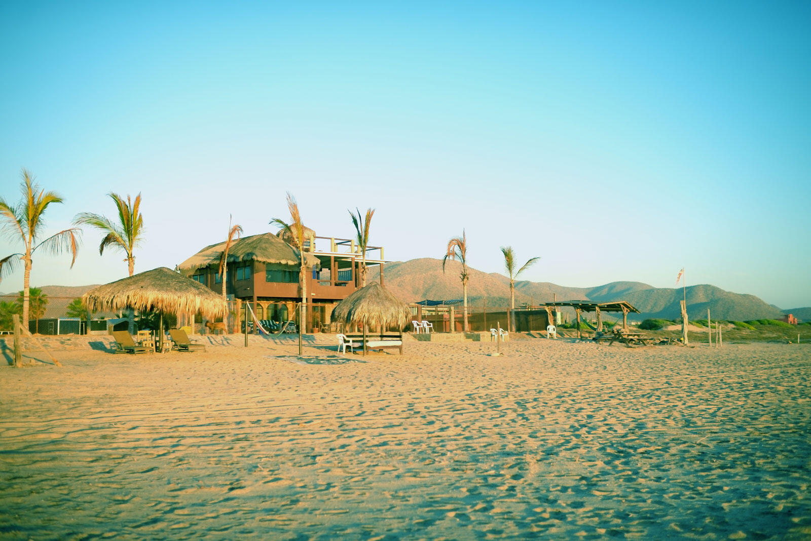Los Cabos Luxury Las Tunas The Nacuii Residence is a refined luxury home crafted to exceed the expectations of even the most discerning buyer. Nestled on a generous and private 3,000 m² lot (0.73 acres), it's just a short, effortless stroll to the untouched, sandy shores of Las Tunas — perfect for enjoying the serene coastal landscape and dramatic sunsets. The home offers a thoughtful layout with 3 spacious bedrooms, a separate studio, a cozy TV lounge, and 6 full bathrooms, including two principal suites, a guest room, a detached studio, and a dedicated media or family room. Expansive sliding glass doors invite natural light throughout the interiors while showcasing tranquil garden for sale